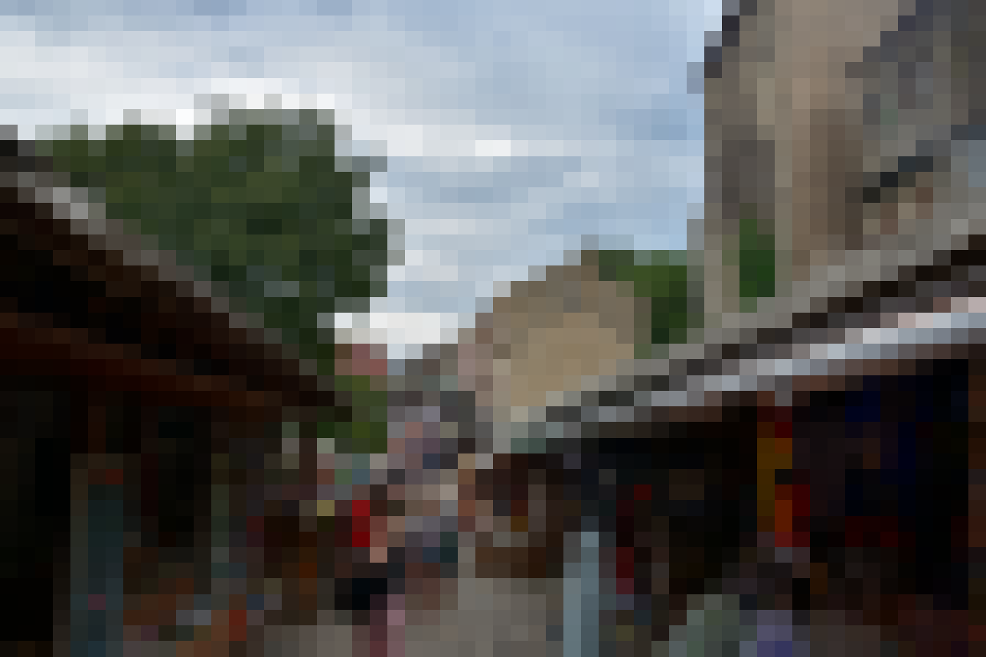 Shoppers browse a market lane in an old Bosnian town