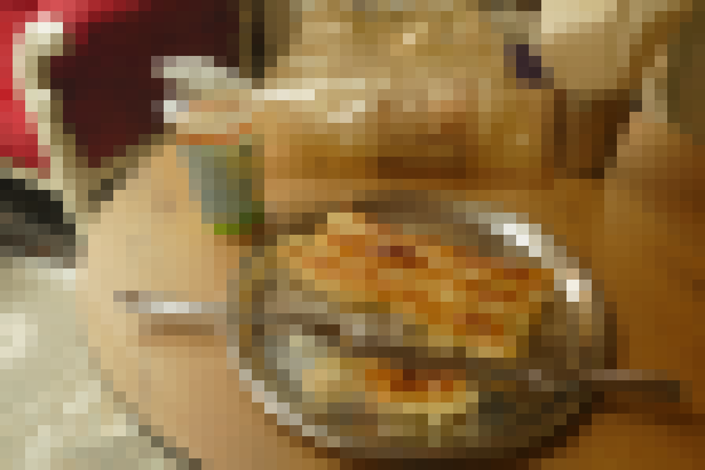 A vendor serves fresh burek to waiting customers