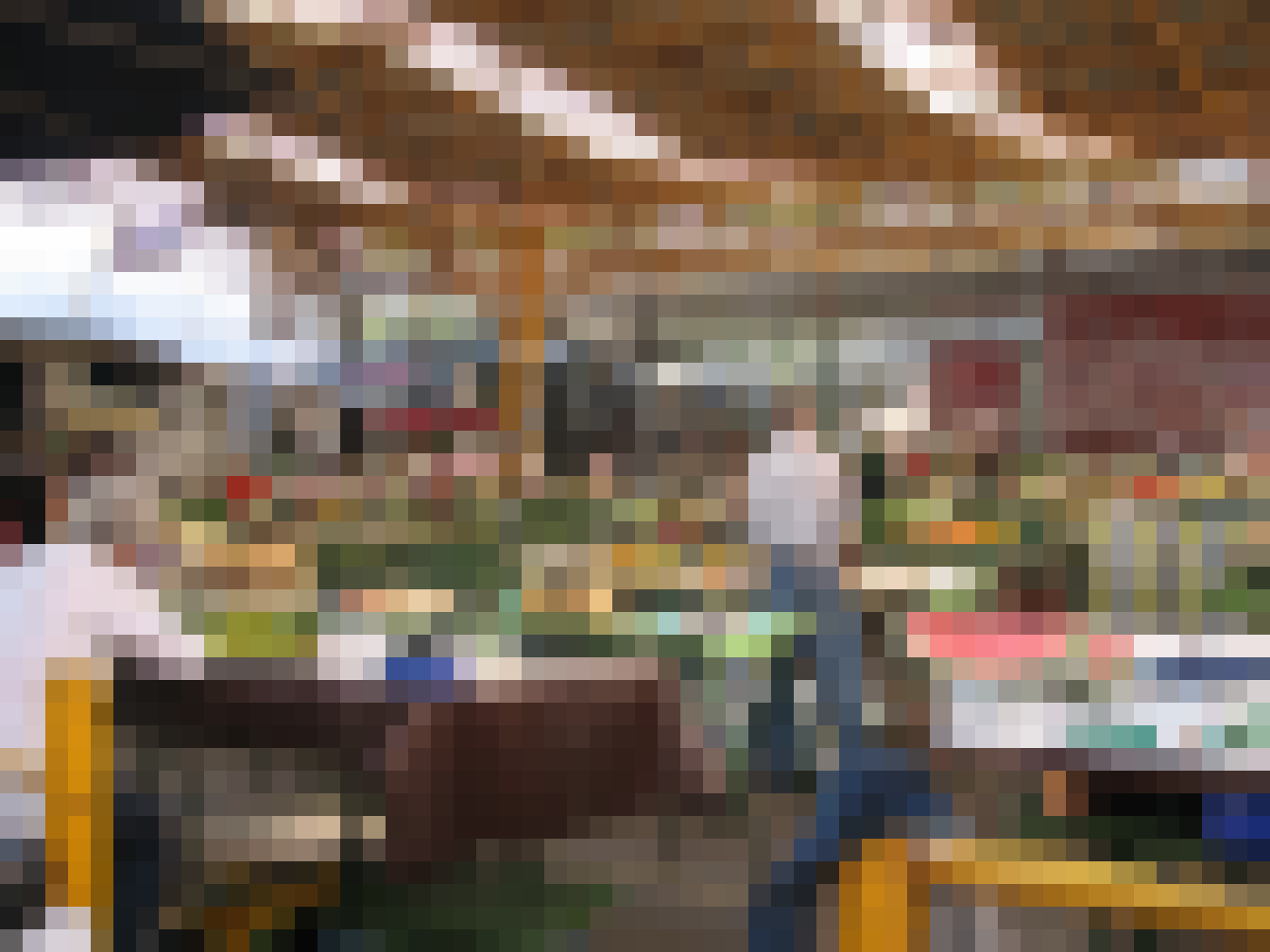 Shoppers browse fruit crates at a Sarajevo market
