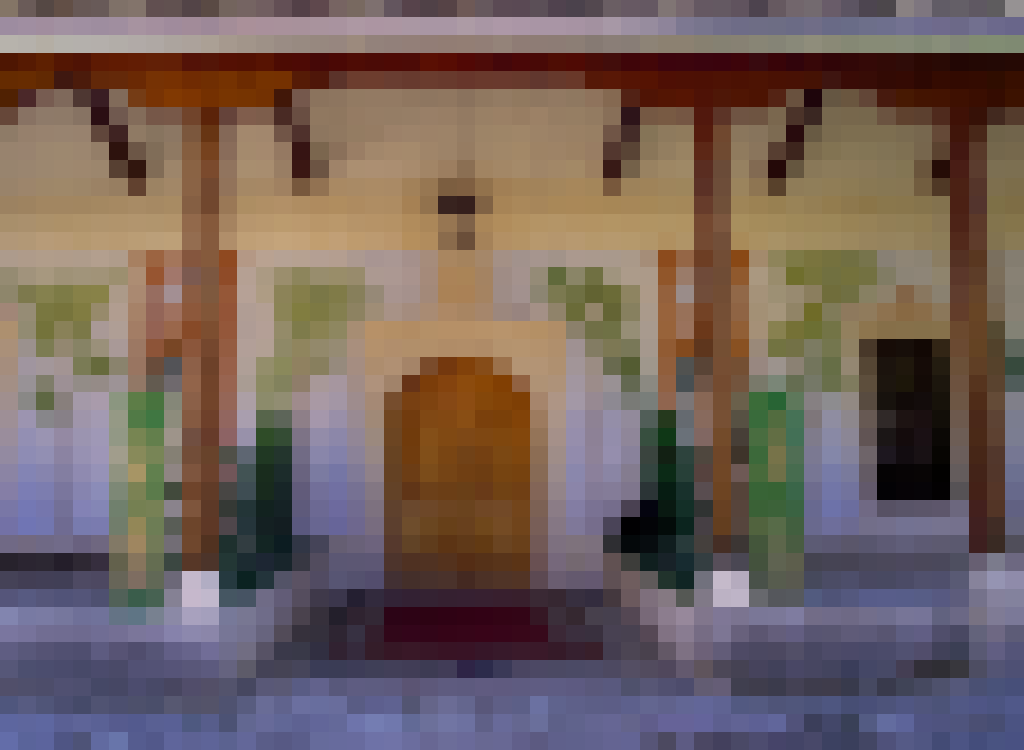 Visitors pause near the Painted Mosque in Stolac